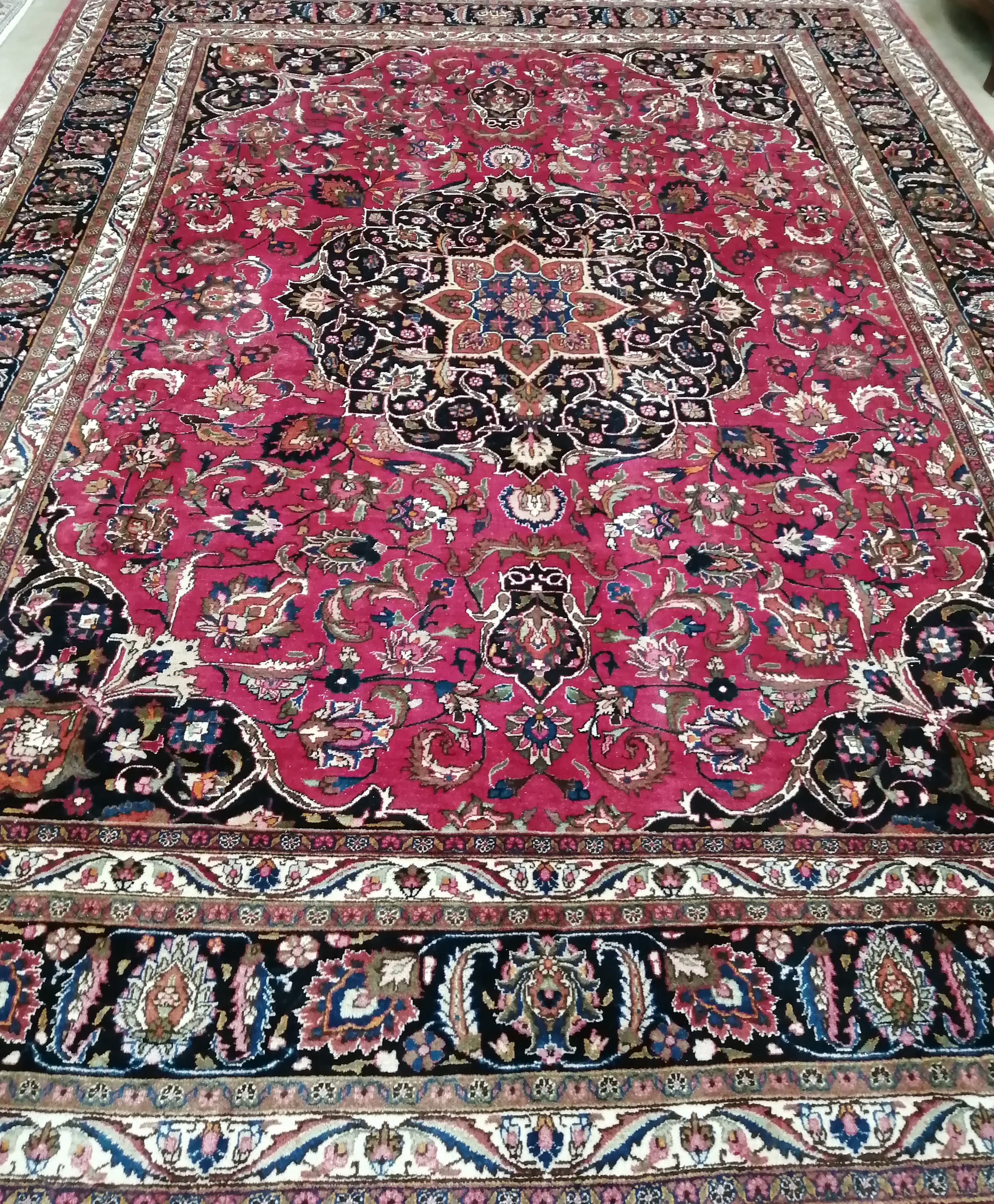 A Heriz red ground floral carpet, 400 x 298cm